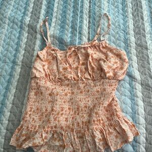 Orange and pink floral tank top with ruffles.